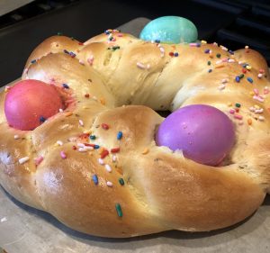 Easter sweets in Italy include pane di Pasqua, a sweet bread topped with colored hard boiled eggs.