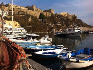 Fishing boats at dock in the marina at Procida island off the Gulf of Naples.